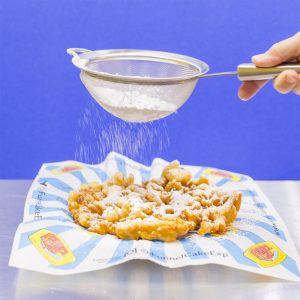 funnel cakes with sugar icing